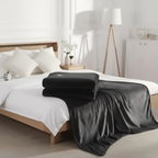 Heated blanket folded on bed